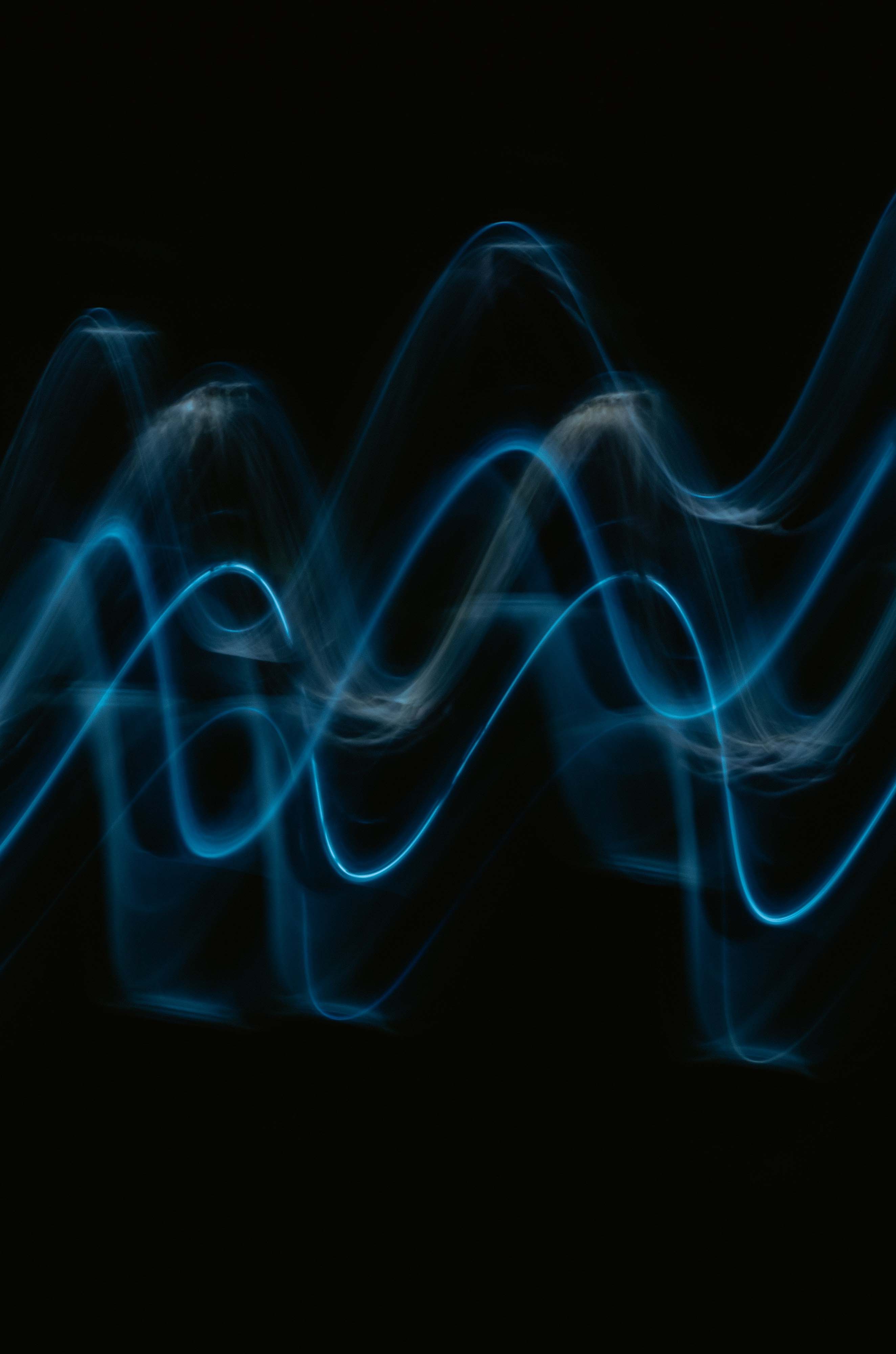 blue sound waves on the black background